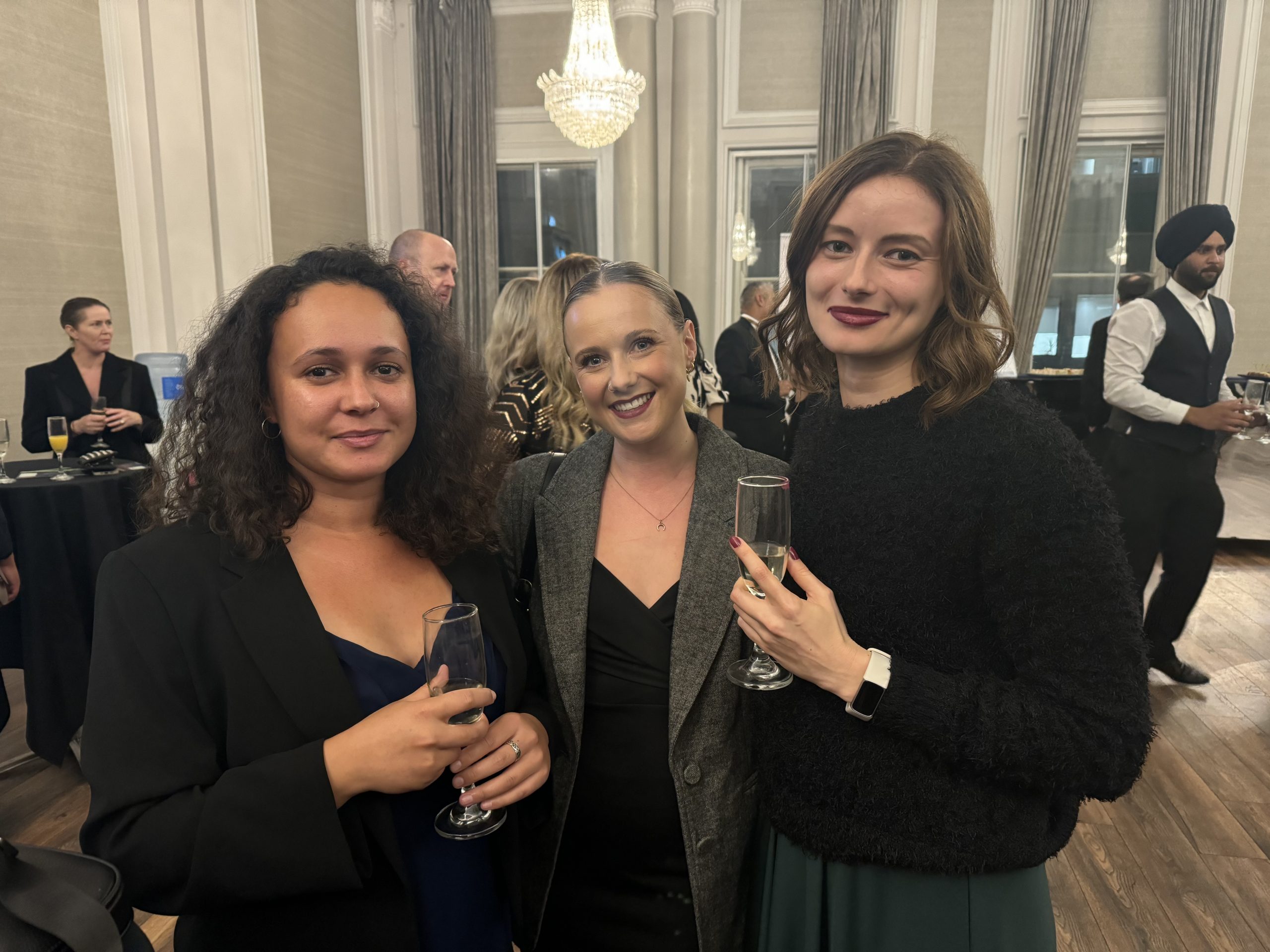 Three women holding champagne glasses 